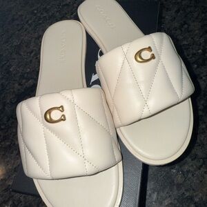 Sold on depop. Coach Women's Chalk color and Gold Quilted leather Slide Sandals
